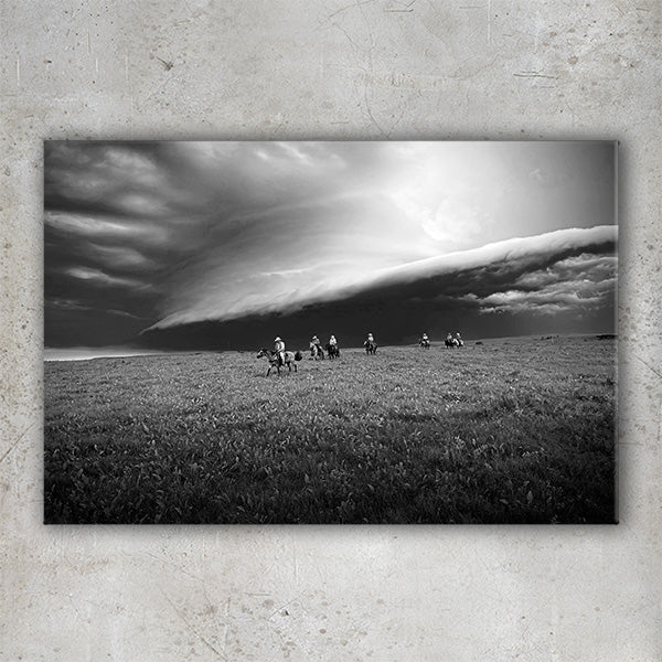 Storm Clouds on the Prairie - Horseback Cowboy Photo Canvas print by artist Garrett Osgood