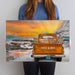 Customized Vintage Truck Canvas Print featuring an orange truck against a breathtaking winter sunrise with Hallelujah clouds. Personalize the tailgate and license plate. Perfect home decor, capturing the warmth of a stunning orange sunrise. Crafted in Wichita, KS, with premium USA-made materials
