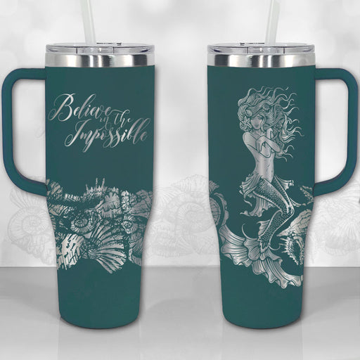 https://wichitagiftco.com/cdn/shop/products/40oz-tumbler-with-handle-mermaid-believe-impossible-thirst-quencher-lid-insulated-travel-mug-dark-teal_512x512.jpg?v=1677395857