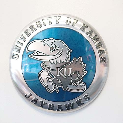 UNIVERSITY OF KANSAS JAYHAWK EMBOSSED METAL BUTTON