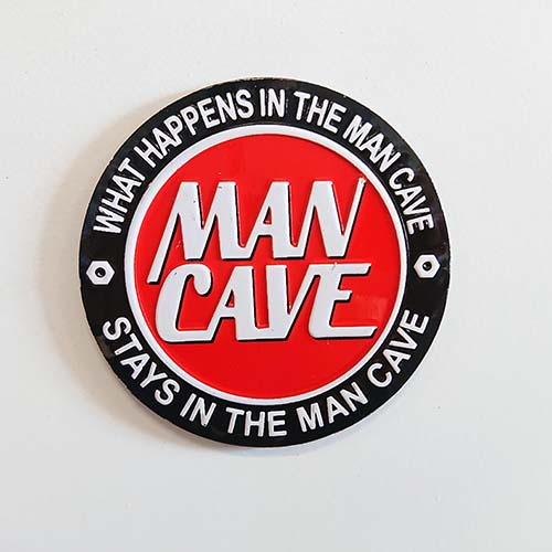 WHAT HAPPENS IN THE MAN CAVE EMBOSSED TIN MAGNET